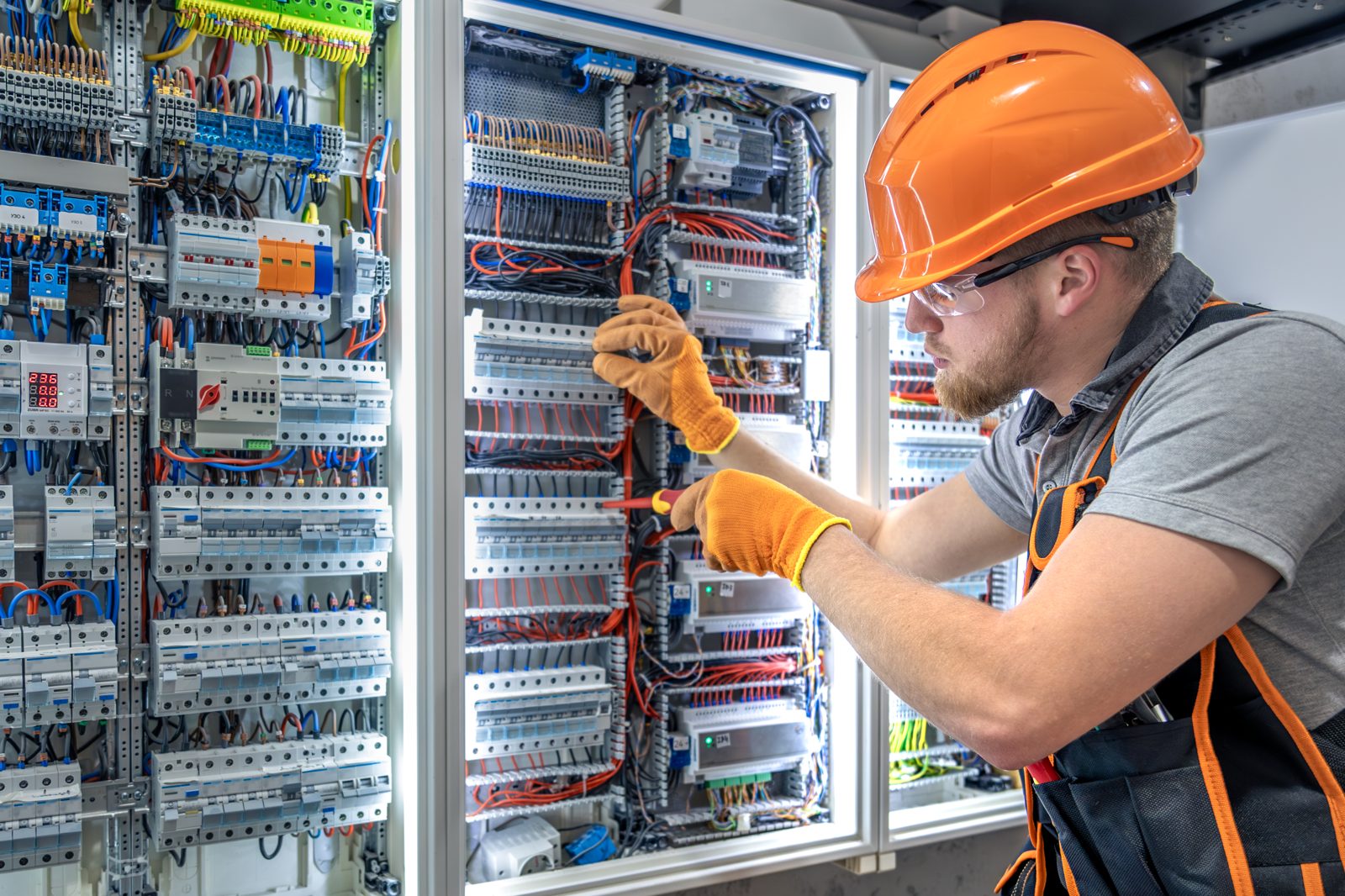 Electrician working on an electrical panel